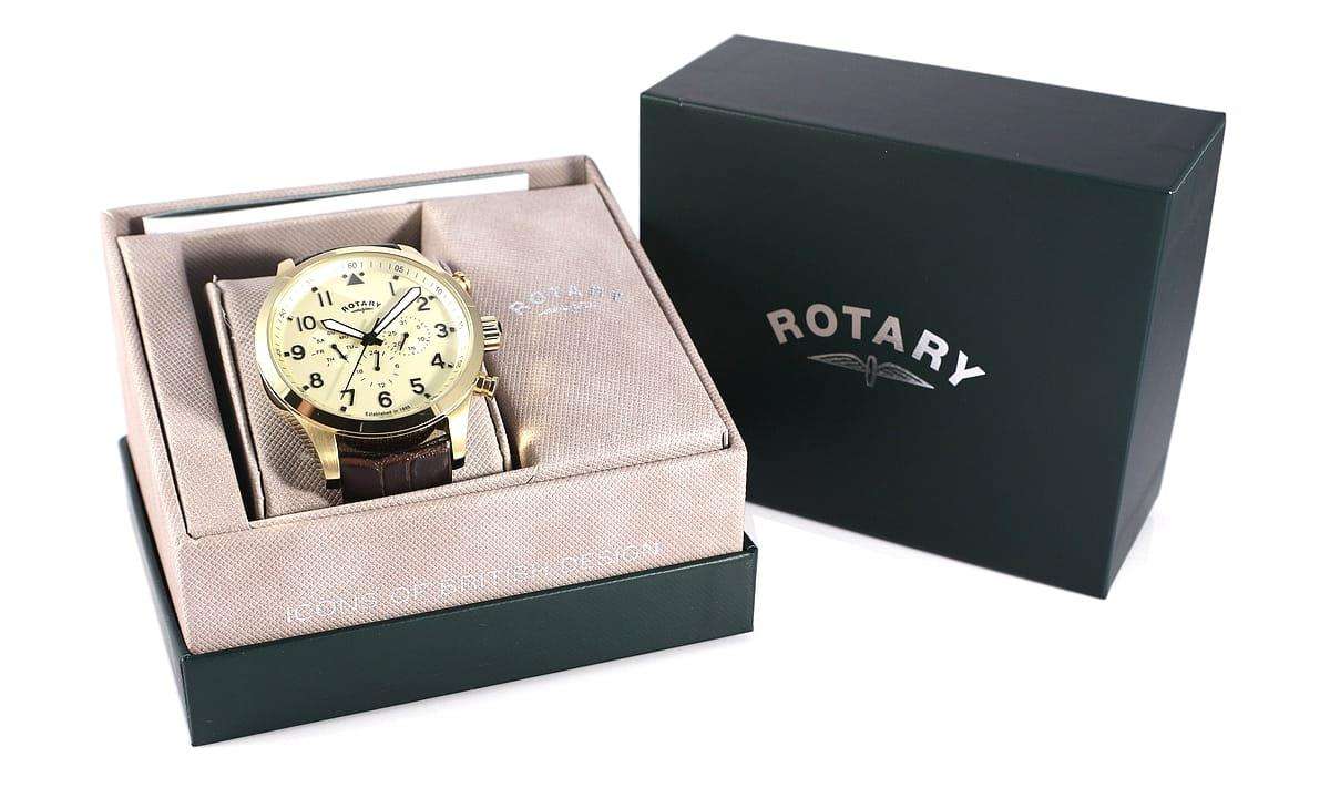 Rotary Gold Coloured Stainless Steel Case Brown Leather Strap Mens Watch GS00419/31 48mmThis Rotary Gold Coloured Stainless Steel Case Brown Leather Strap Mens Watch GS00419/31 teams an alluring cream dial with a curved 12 o’clock day window and a brown leather strap and case. This results in a timepiece that is the epitome of style and class. Key Features:Quartz MovementDay FunctionBuckle Clasp The Brand: RotaryFamed for his attention to detail and keen business acumen, Moise