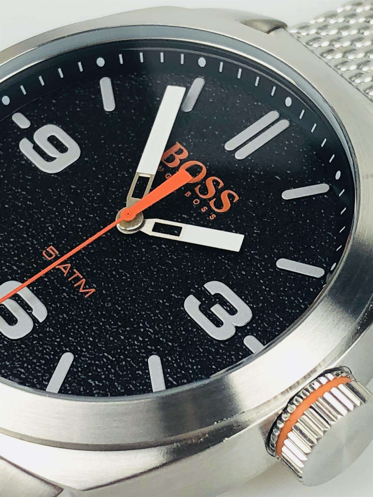 The Watch: Hugo Boss Orange Cape Town Stainless Steel Mesh Strap Stainless Steel Case Men’s Watch 1550013In a homage to the mountainous city from which it takes its name, this Hugo Boss Orange Cape Town Stainless Steel Men’s Watch (1550013) features a confident stainless steel mesh bracelet and case, with a sleek and contemporary dial design ensuring this sense of adventure is underpinned by the Hugo Boss design ethos. Key Features:Quartz MovementBlack DialStainless Steel Mesh BraceletWater Resistant t
