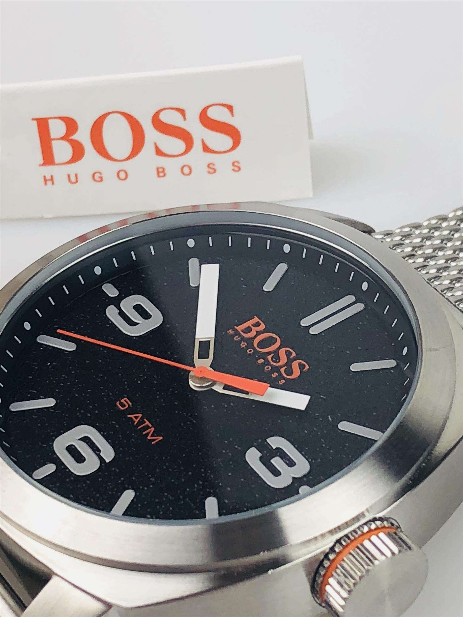 The Watch: Hugo Boss Orange Cape Town Stainless Steel Mesh Strap Stainless Steel Case Men’s Watch 1550013In a homage to the mountainous city from which it takes its name, this Hugo Boss Orange Cape Town Stainless Steel Men’s Watch (1550013) features a confident stainless steel mesh bracelet and case, with a sleek and contemporary dial design ensuring this sense of adventure is underpinned by the Hugo Boss design ethos. Key Features:Quartz MovementBlack DialStainless Steel Mesh BraceletWater Resistant t