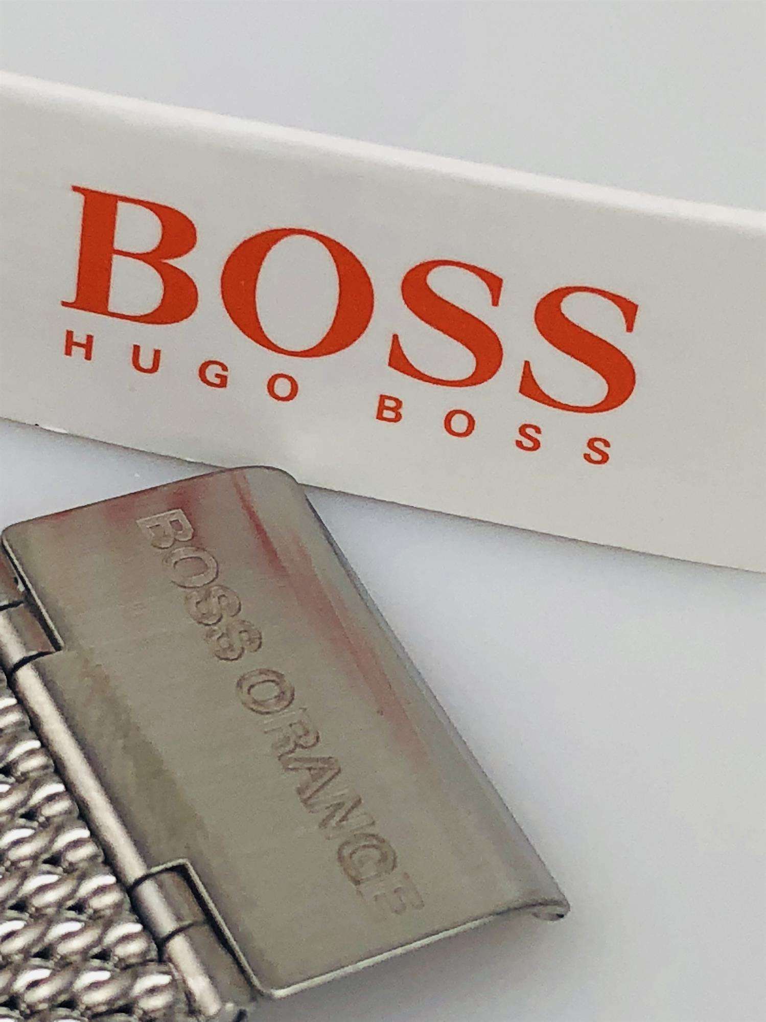 The Watch: Hugo Boss Orange Cape Town Stainless Steel Mesh Strap Stainless Steel Case Men’s Watch 1550013In a homage to the mountainous city from which it takes its name, this Hugo Boss Orange Cape Town Stainless Steel Men’s Watch (1550013) features a confident stainless steel mesh bracelet and case, with a sleek and contemporary dial design ensuring this sense of adventure is underpinned by the Hugo Boss design ethos. Key Features:Quartz MovementBlack DialStainless Steel Mesh BraceletWater Resistant t