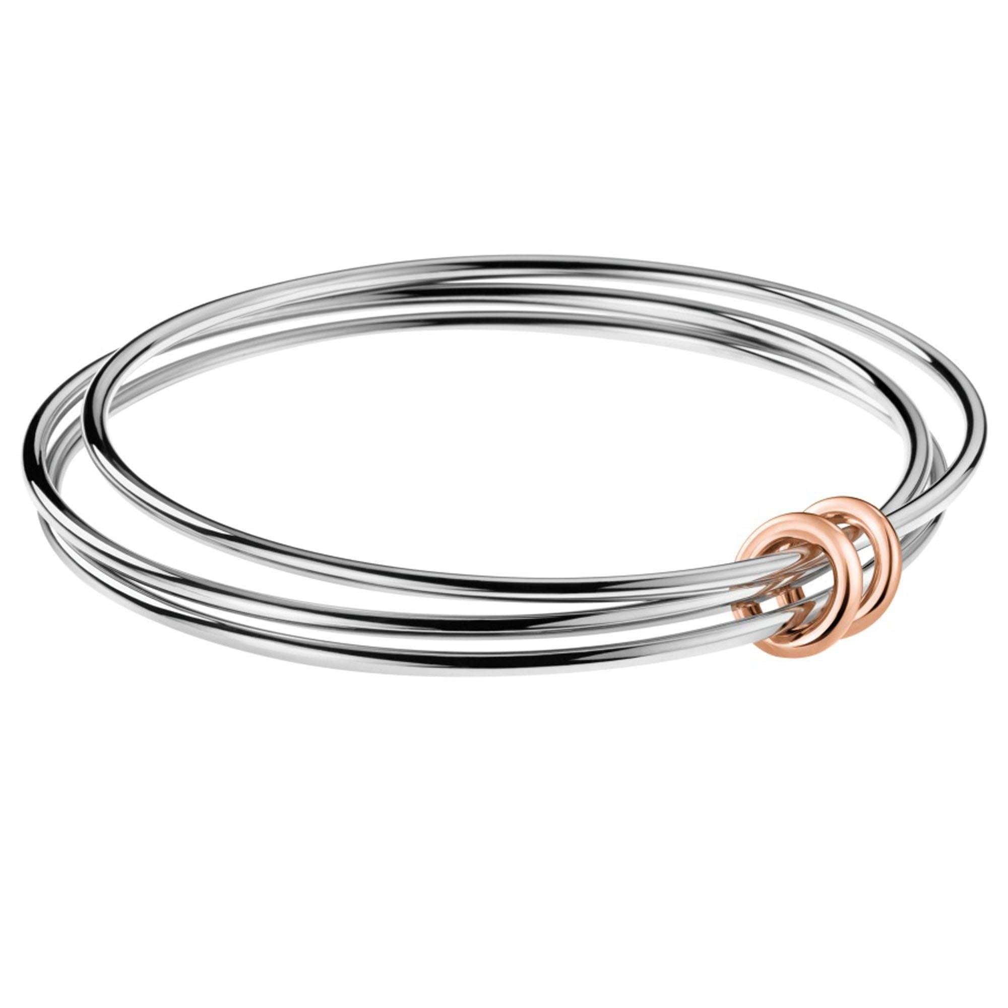 Calvin Klein Two Tone Stainless Steel Ladies Bangle KJ5HMD20010SThis Swiss-made Calvin Klein Bangle is fashioned for the ladies. It is built to the highest quality with three combined bangles joined via two rose gold plated rings. The bangle is a bold piece, perfect for any occasion.Key Features:Size SmallNimble CollectionThree Combined BanglesThe Brand: Calvin KleinCalvin Klein is one of the truly iconic cultural forces to emerge from the twentieth century. Based on bold, progressive thinking an