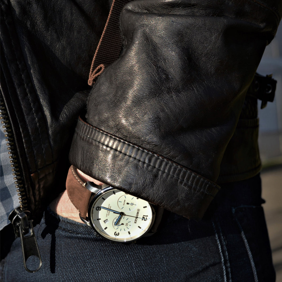 Wenger Metropolitan Chronograph 01.1743.111 wrist portrait showing cream dial timepiece styled with a black leather jacket