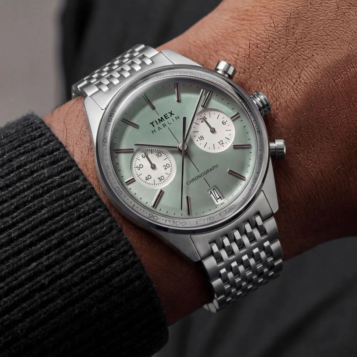 Timex Marlin Jet TW2Y89800 wrist view showing green dial meca-quartz watch styled on a person wearing a steel bracelet