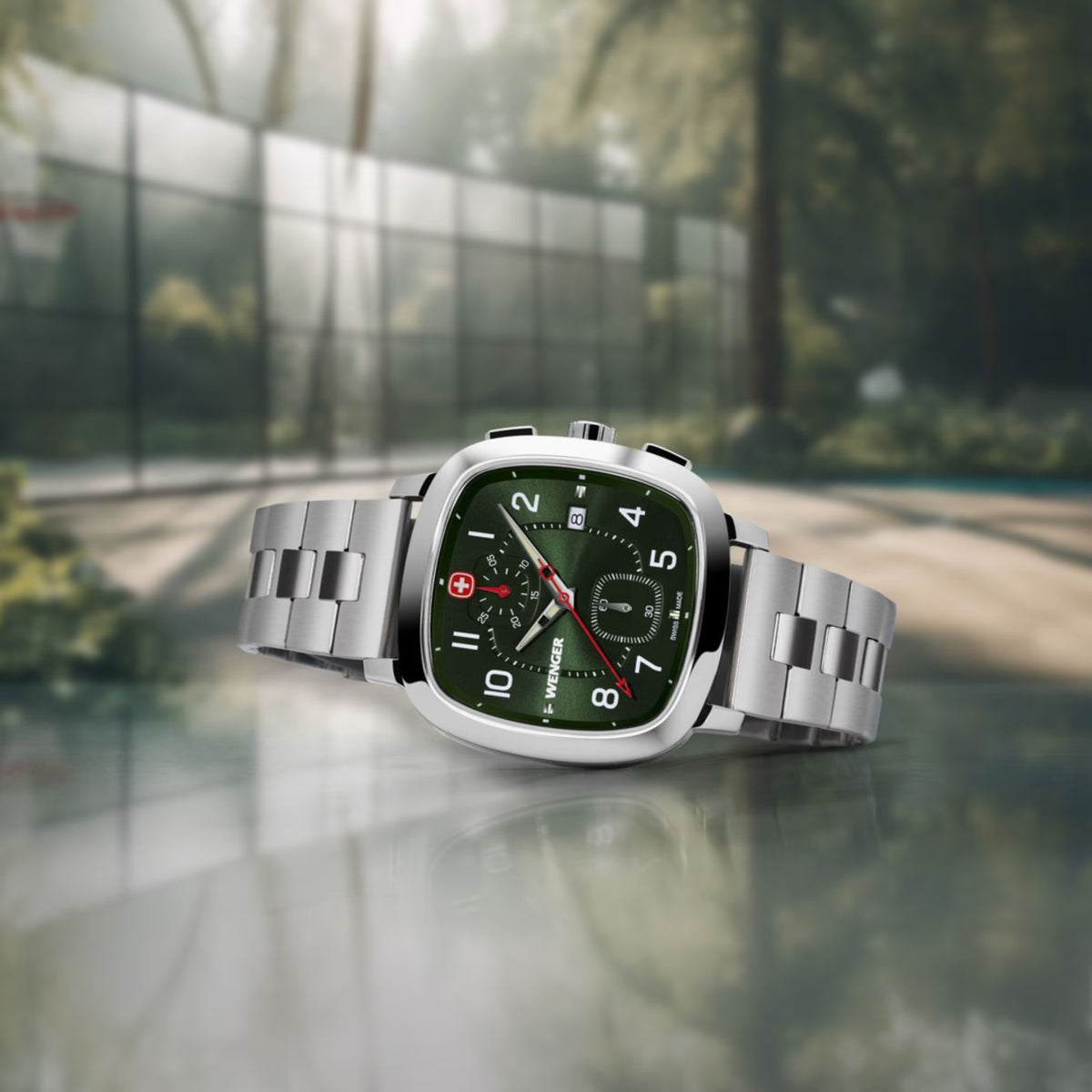 Wenger Vintage Sport 01.1933.112 angled perspective view displaying cushion green dial face and stainless steel bracelet