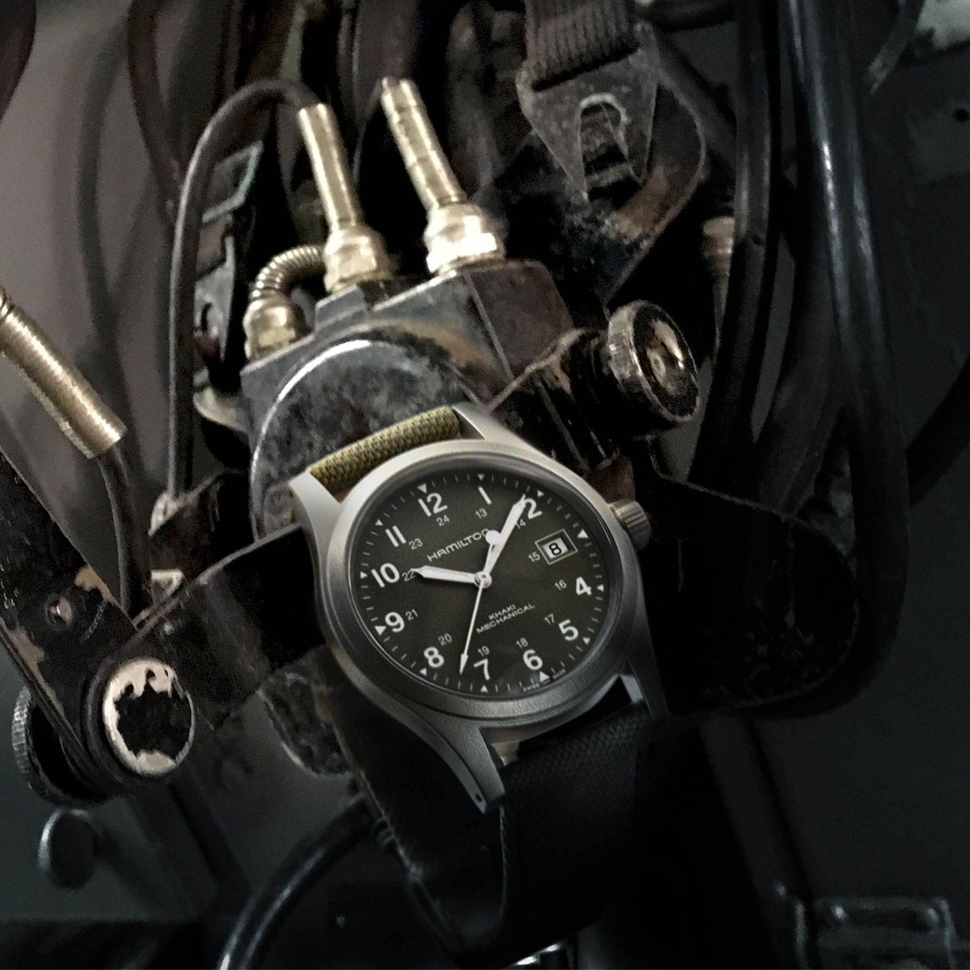 Hamilton Khaki Field Mechanical H69439363 watch with a green dial and green canvas strap.
