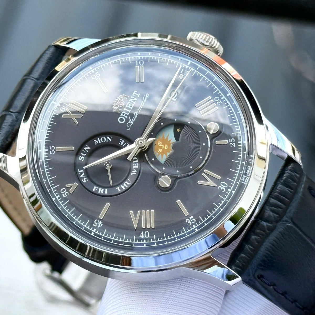 Orient Bambino Sun & Moon Blue Dial Leather Strap Men's Dress Watch RA-AK0806L30B