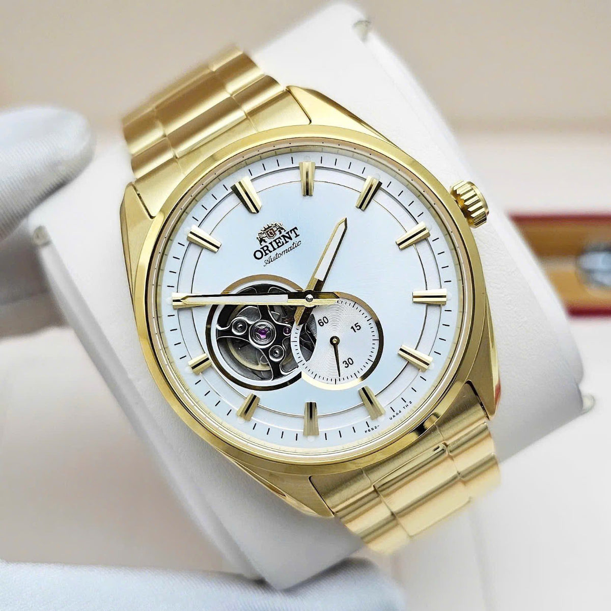 Orient RA-AR0007S30B gold accent dress watch with white open heart dial