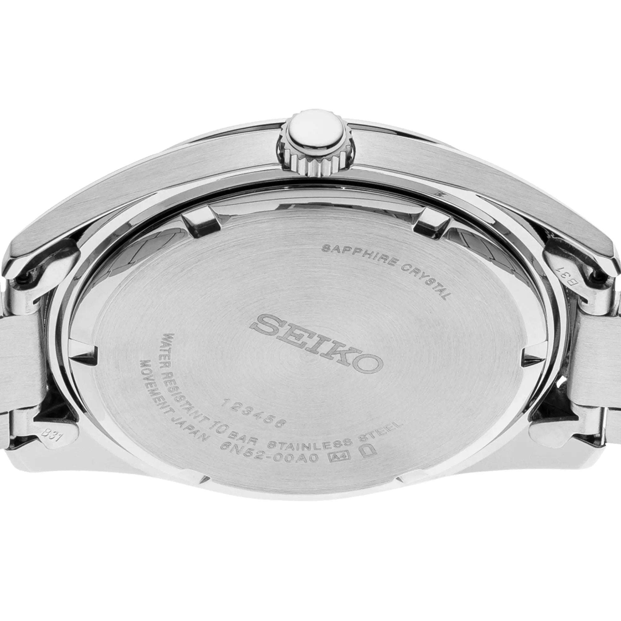 Close-up of the stainless steel caseback of Seiko SUR309P1 showcasing technical specifications and branding details