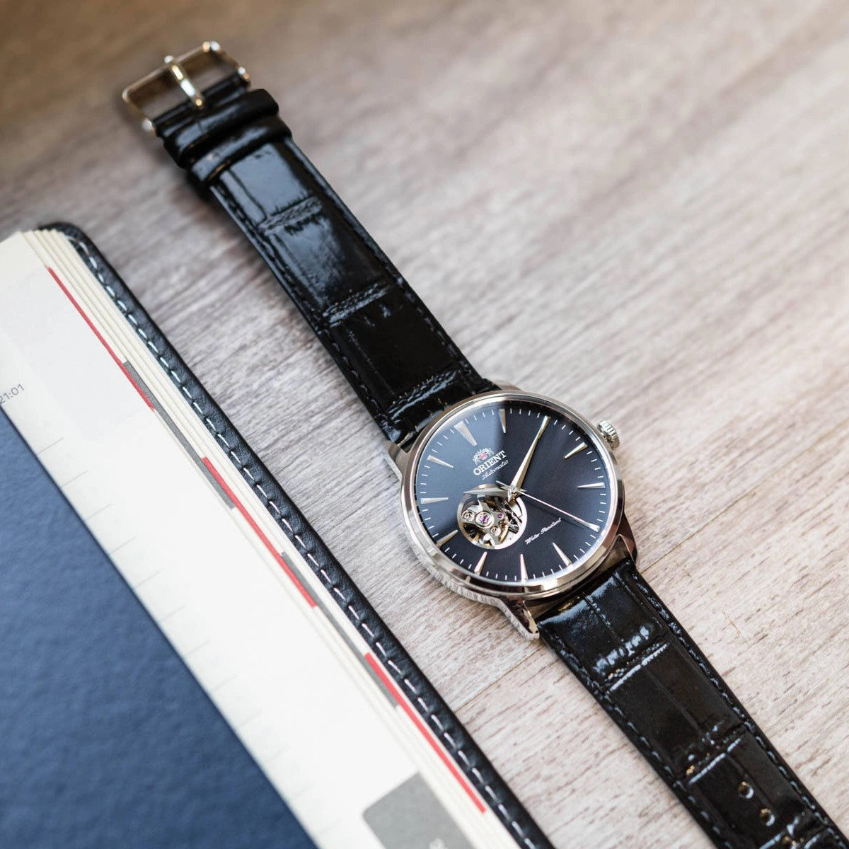 Orient Contemporary Open Heart Automatic Black Dial Leather Strap Men’s Watch TAG02004B0