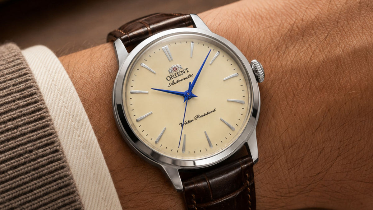 Orient Bambino 36mm dress watch leaving a symmetrical three-hand dial inside a case