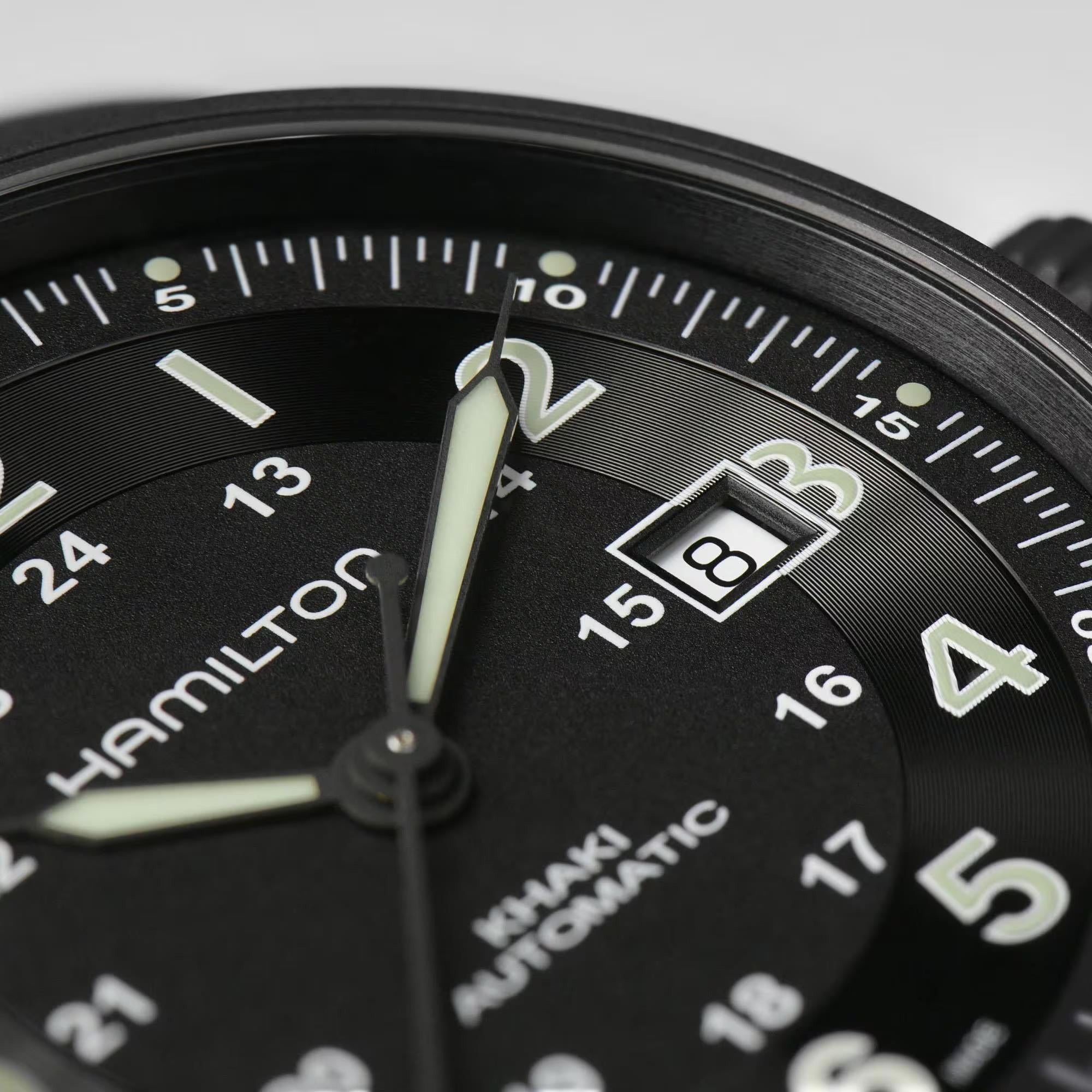 Hamilton Khaki Field H70575733 black dial with Arabic numerals and date display close-up
