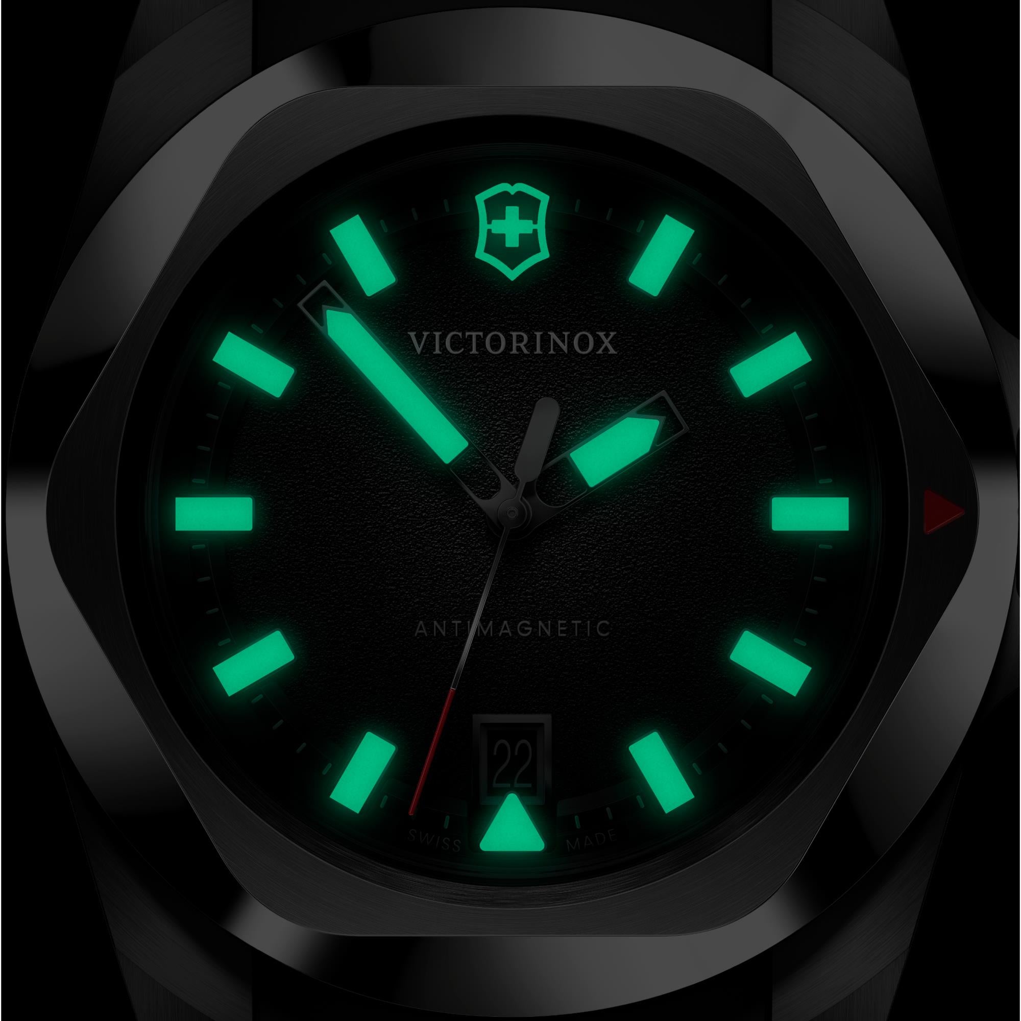 Front view of a Victorinox I.N.O.X. 242030 watch highlighting bright green luminous hands
