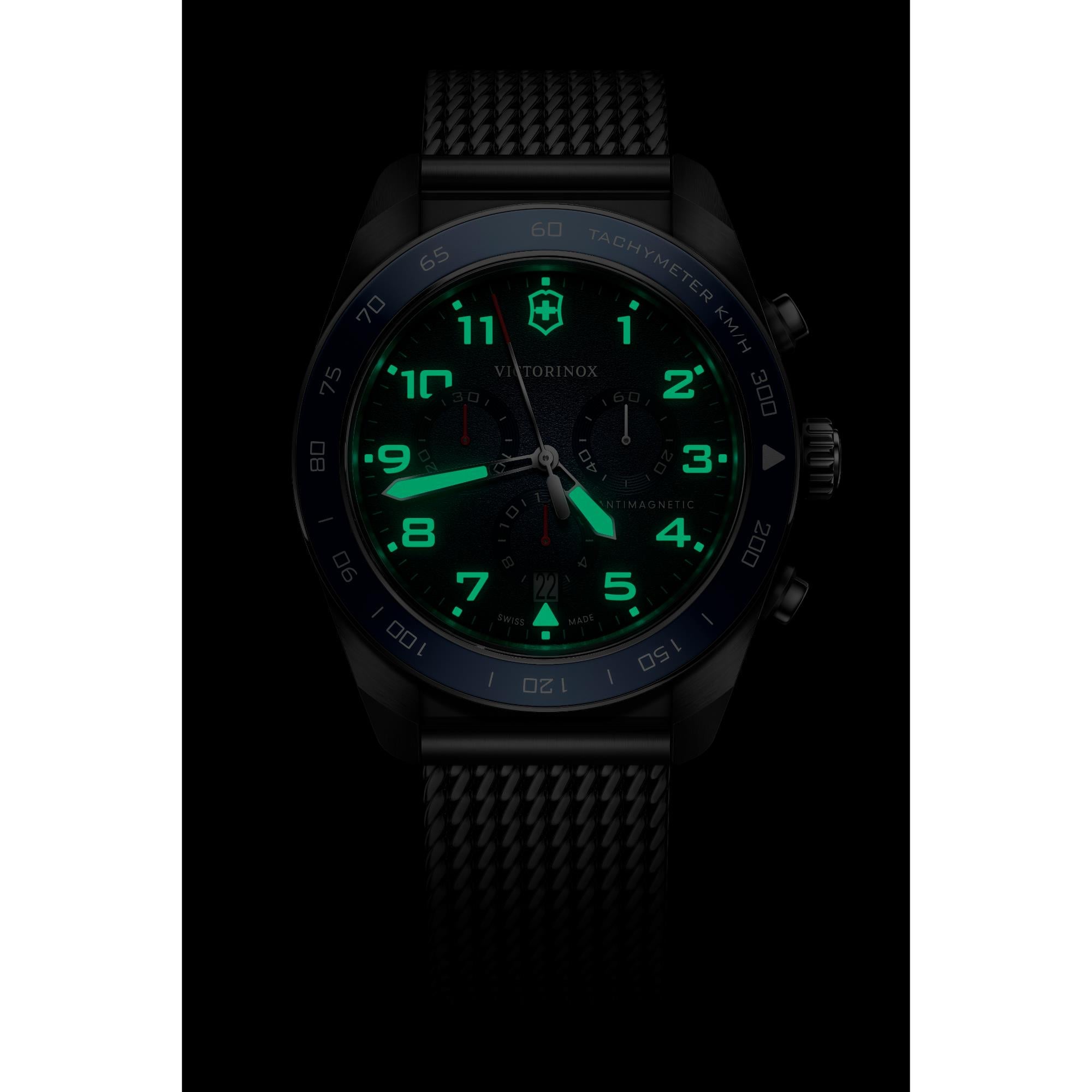 Victorinox Swiss Army 242049 Chronograph watch with intense green lume on black dial in dark environment