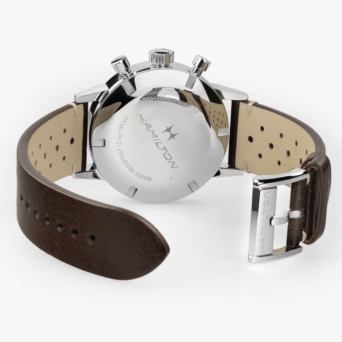 Caseback of a stainless steel Hamilton chronograph watch with a brown leather strap
