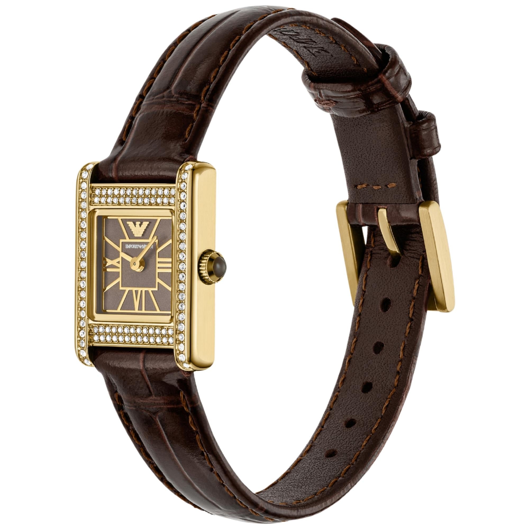 Brown leather strap quartz watch showing crown and gold-tone square case with diamond trim