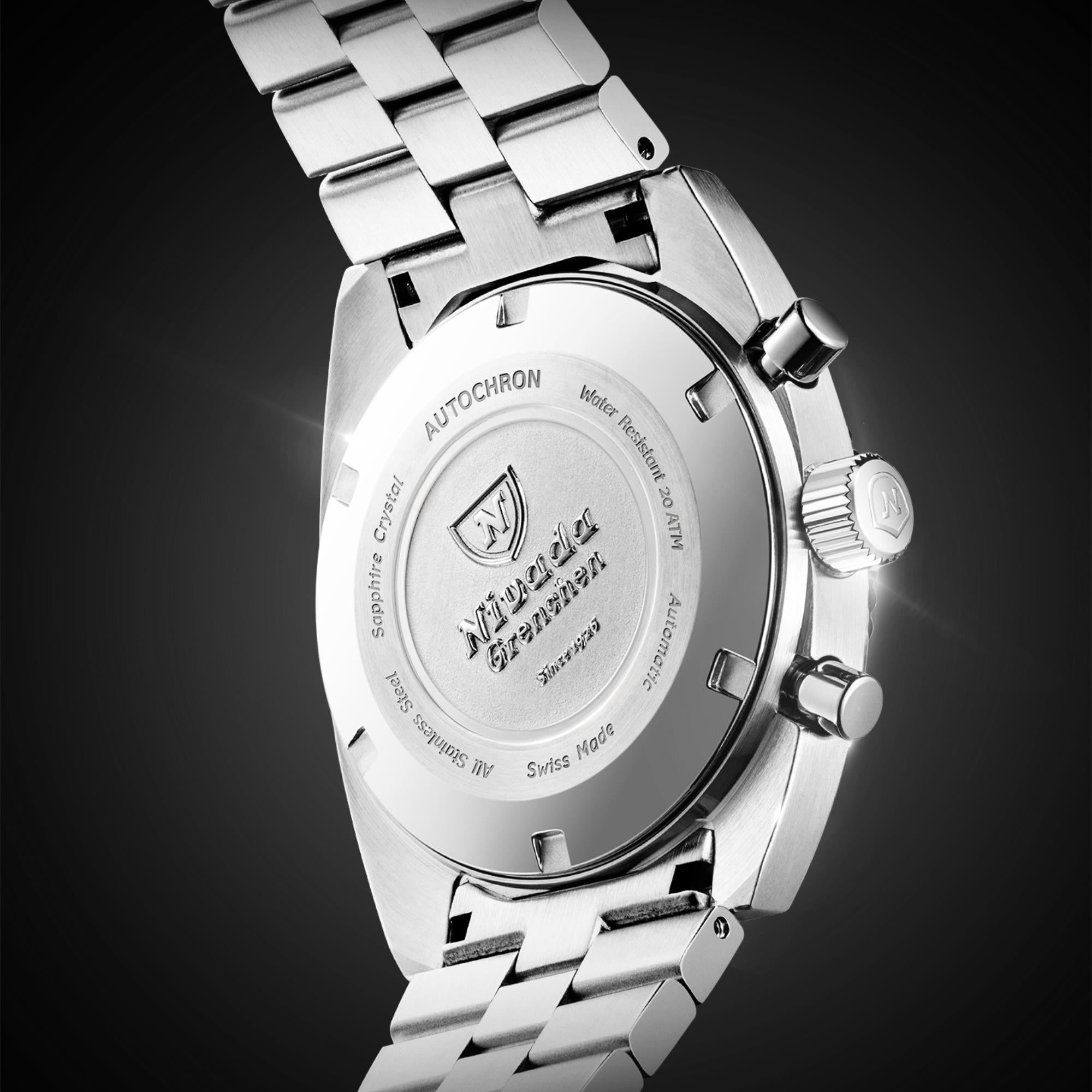 Stainless steel watch case back with engraved insignia and pushers