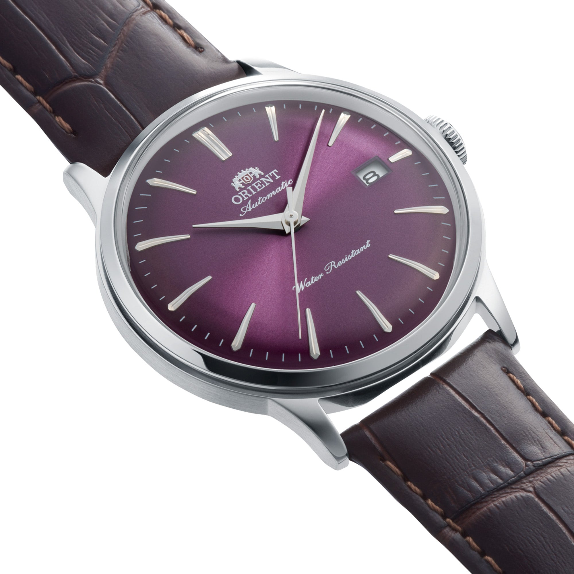 Purple sunburst dial Orient Bambino watch with a brown leather strap