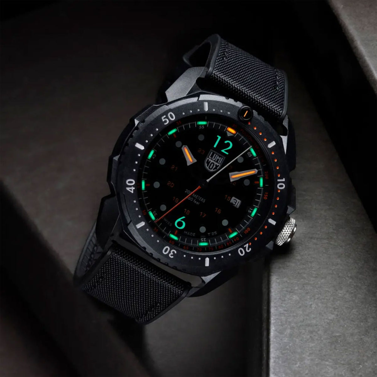 Luminox ICE SAR Arctic 1050 Series XL.1052 mens black dial watch angled view resting on box showcasing night illumination