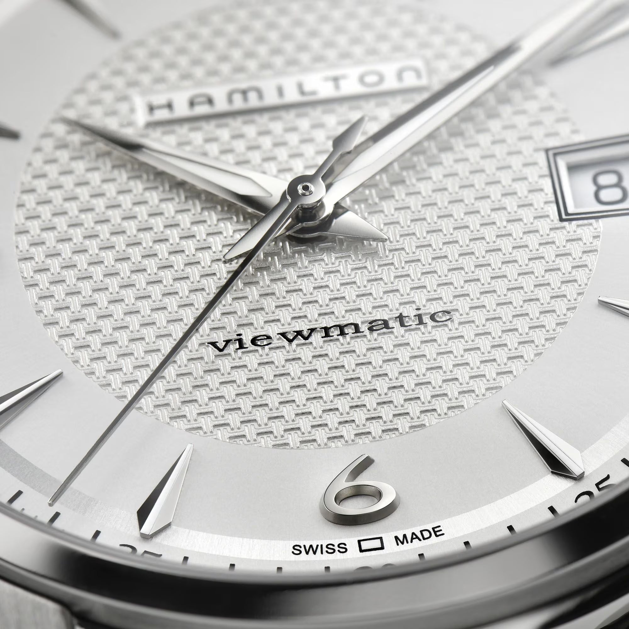 Silver dial close-up with Viewmatic text and baton hour markers
