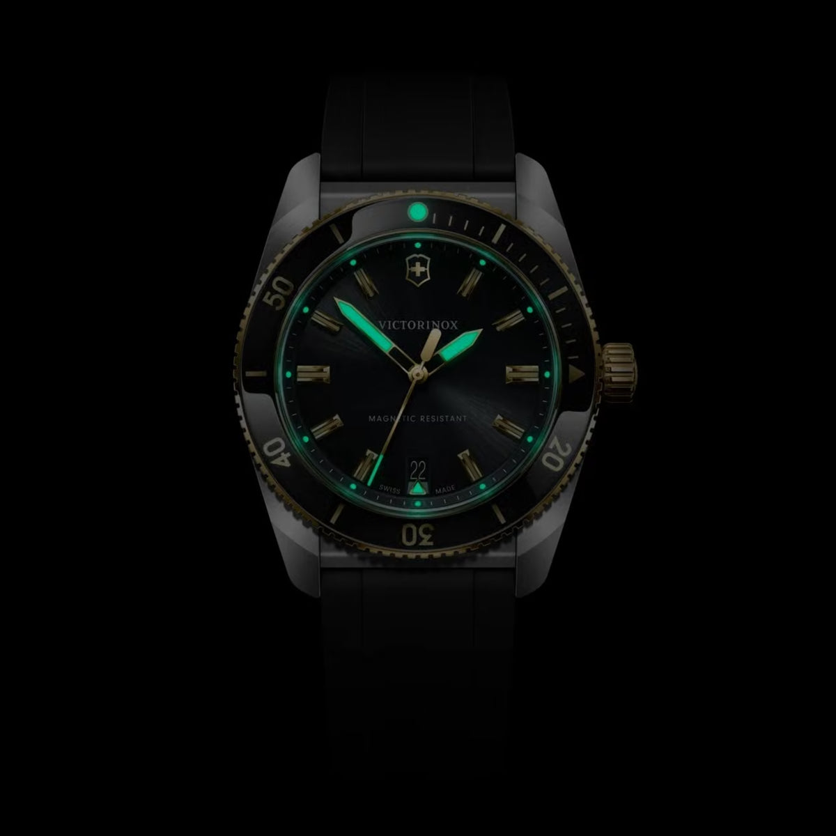 Victorinox Maverick 242099 39mm black dial watch luminescent glow close-up showing green luminous hands and hour markers in dark