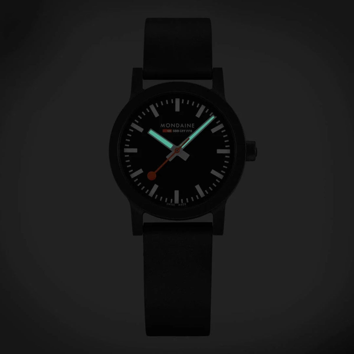 Mondaine Essence MS1.32120.RB luminous glow view highlighting hands and markers in dark conditions