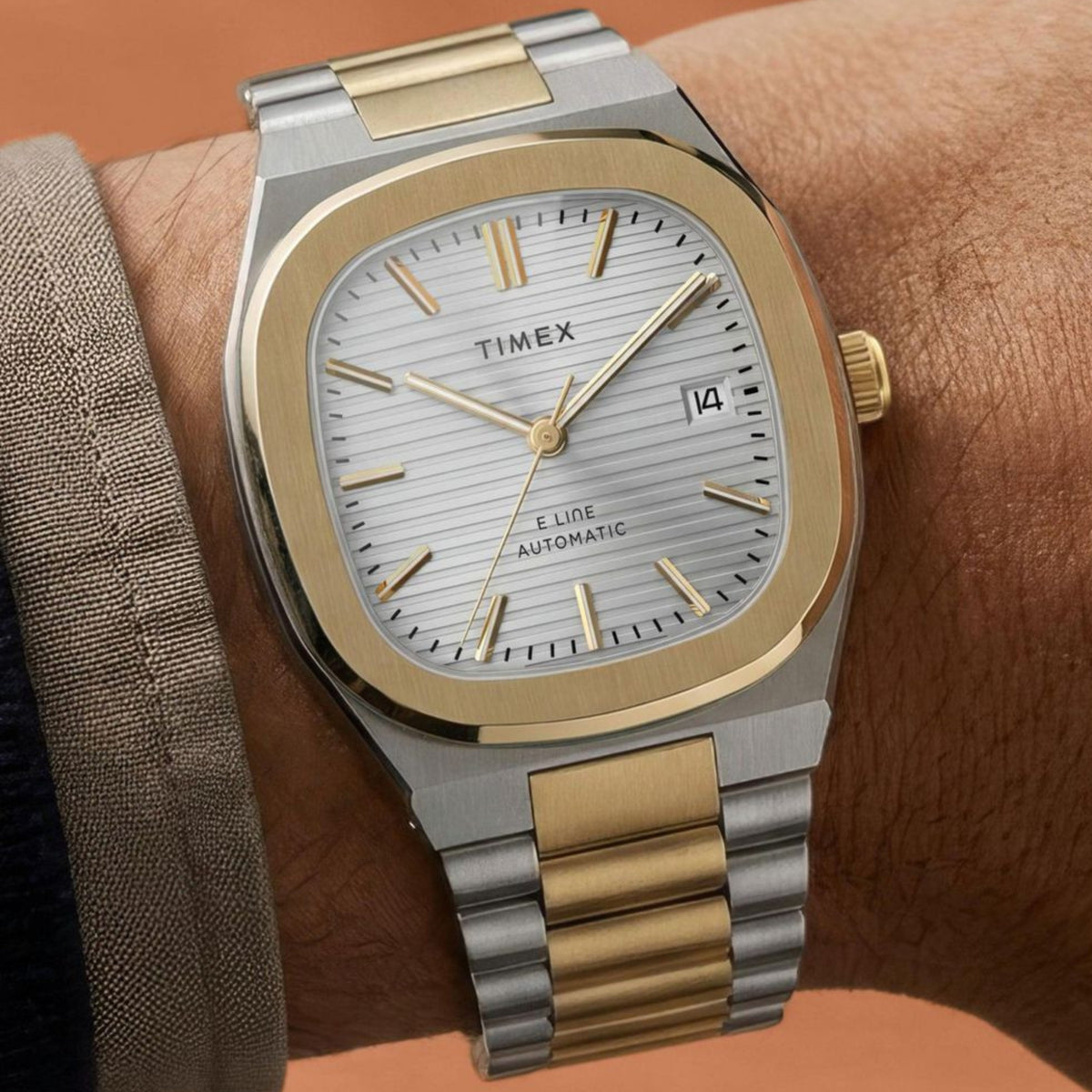 Timex E Line TW6A00600 wrist view showing silver dial automatic watch styled on a person wearing a two-tone steel bracelet