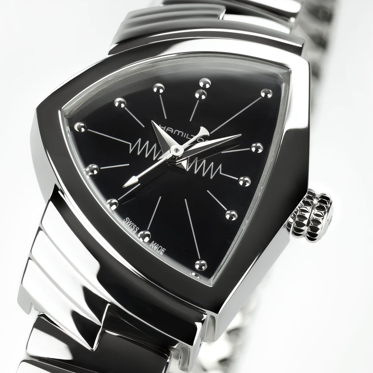 Triangular black dial quartz watch on stainless steel bracelet, metal bezel detail