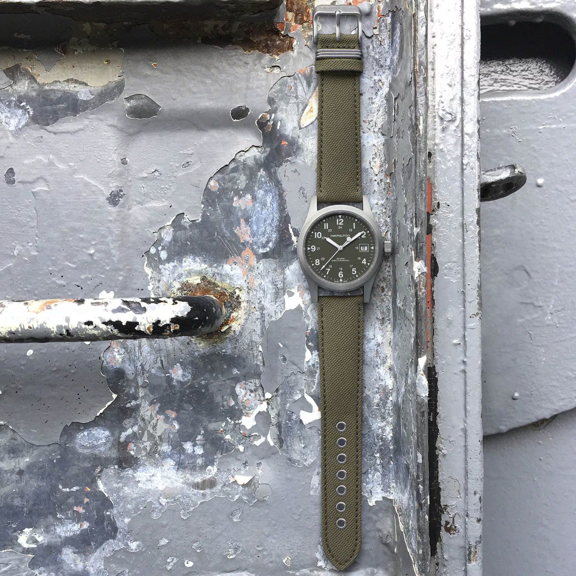 Hamilton Khaki Field 38mm H69439363 Mechanical watch with a green dial and green canvas strap.