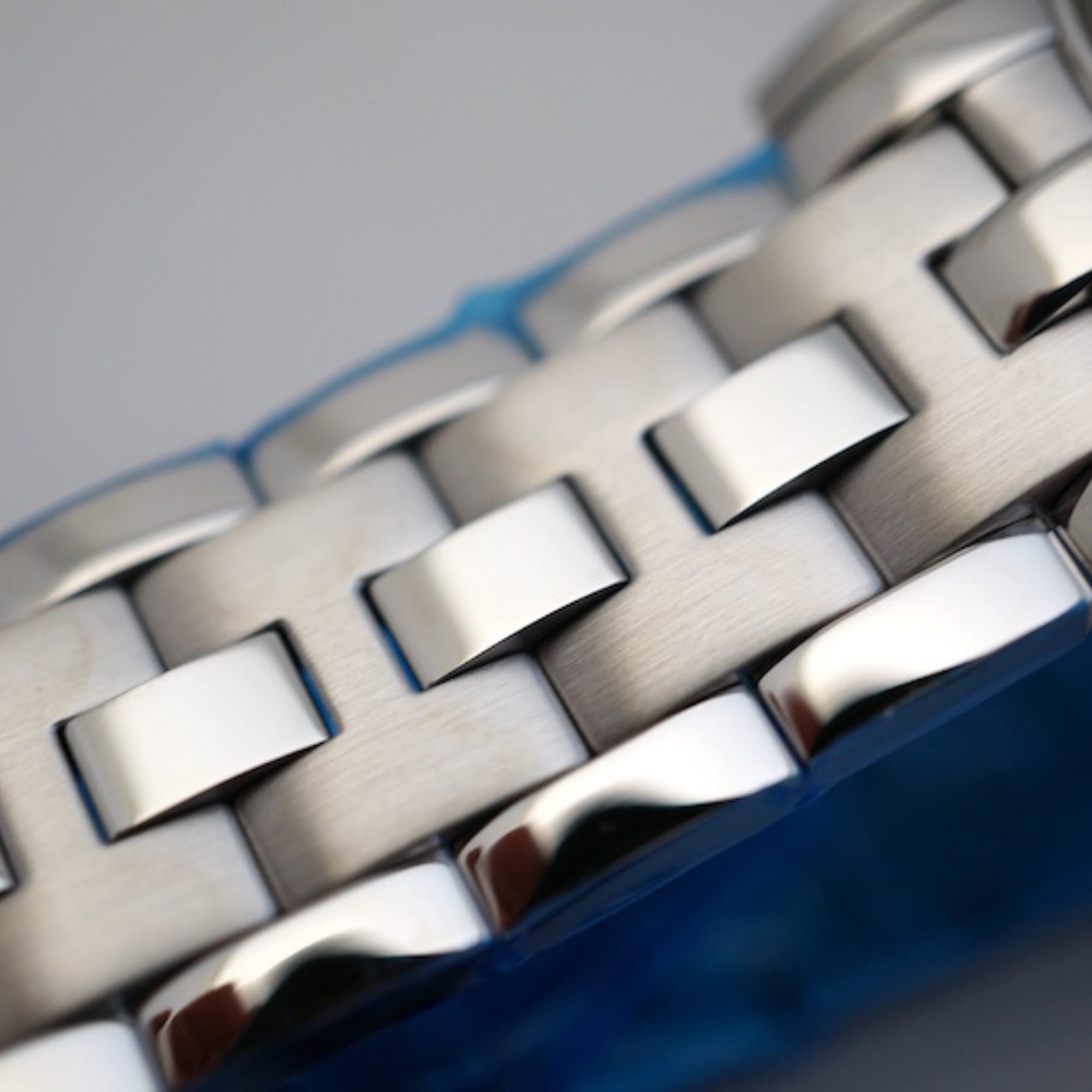 Silver steel bracelet links with bold Hamilton logo on the clasp