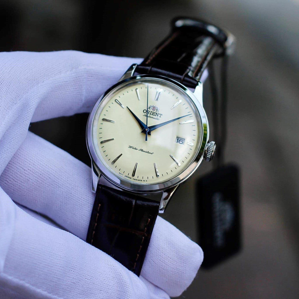 Orient Bambino Mechanical Champagne Dial Leather Strap Men’s Watch RA-AC0M04Y30B