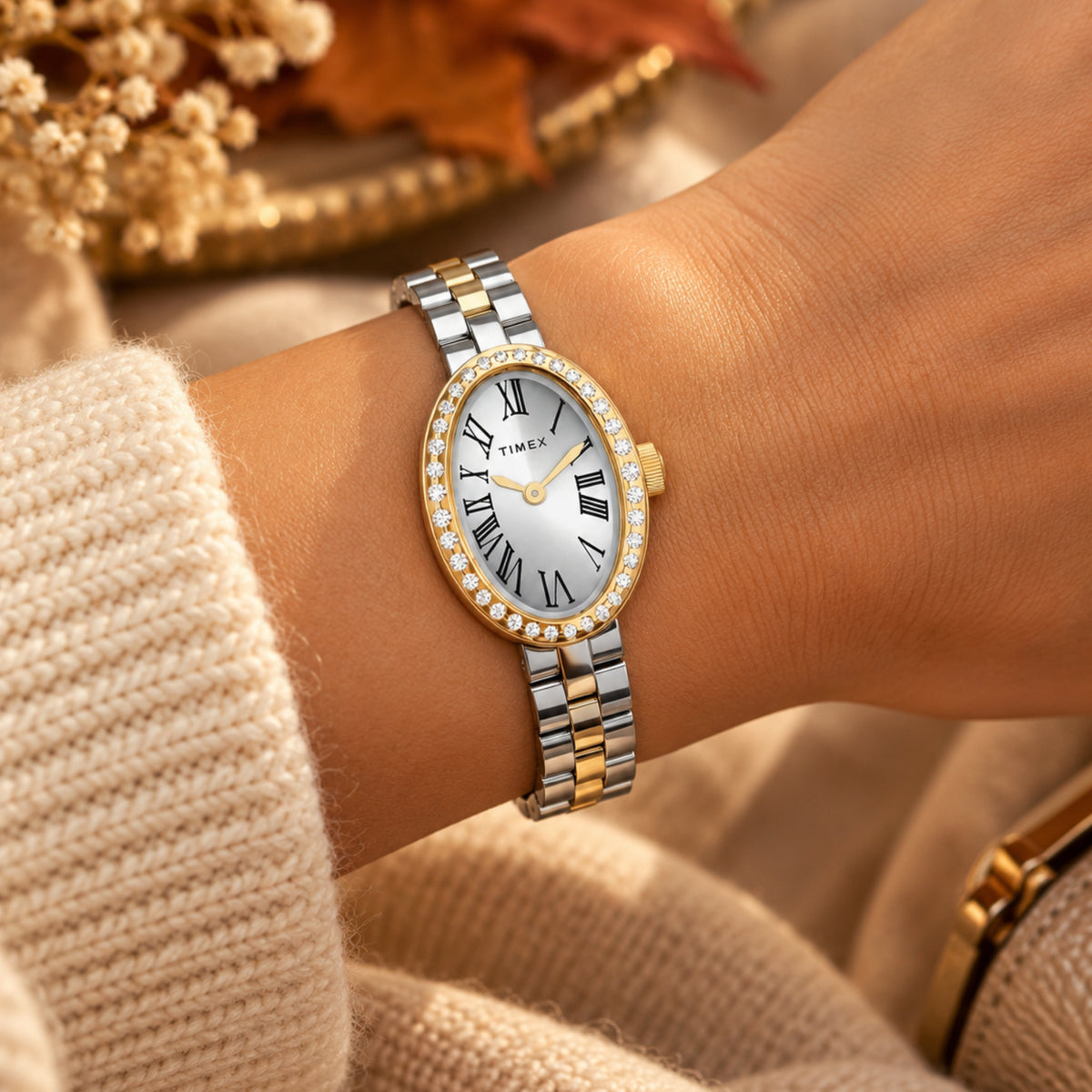 Timex Trend Cavatina TW2Y90200 wrist view showing silver dial quartz watch styled on a person wearing a two-tone steel bracelet