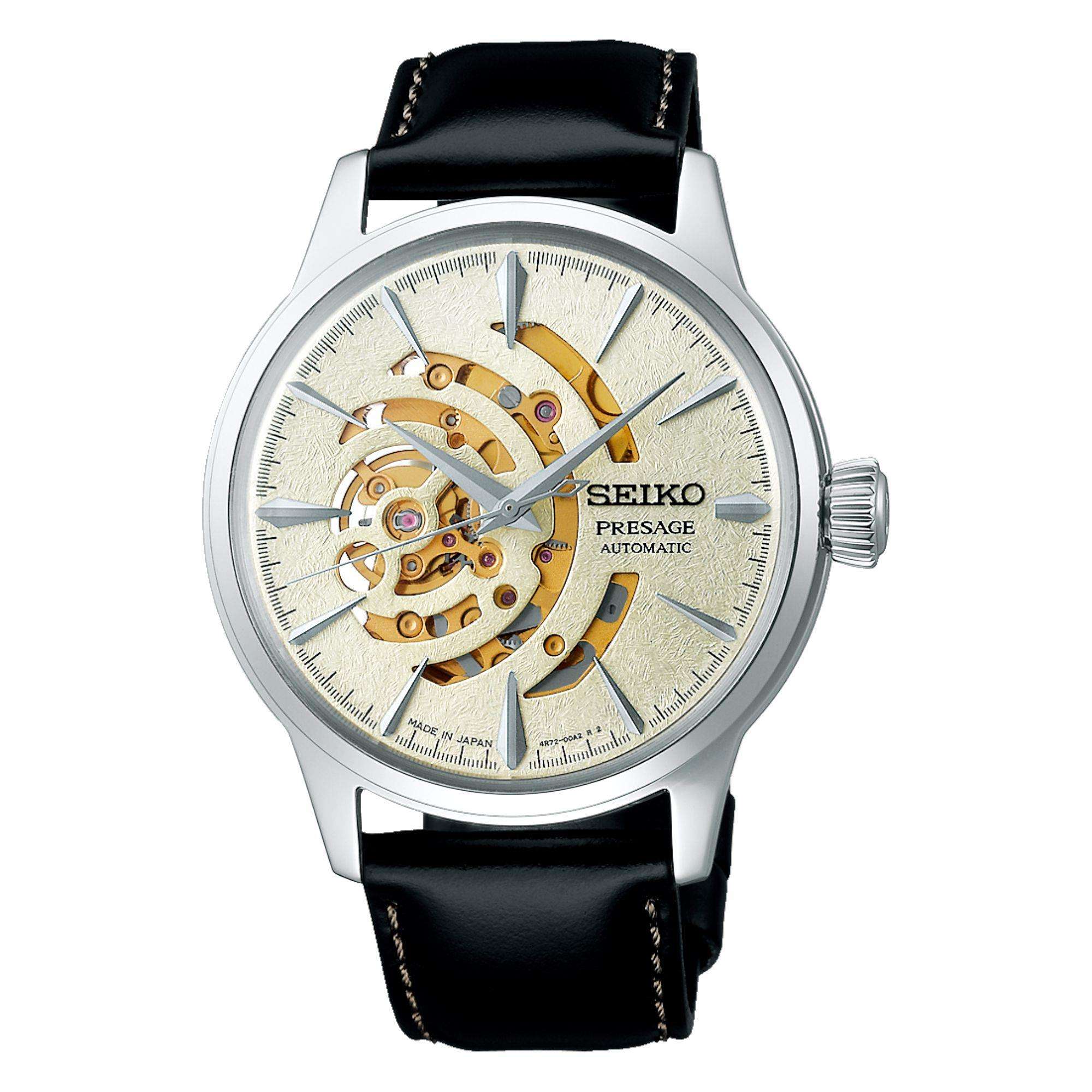 Seiko watch with black leather strap and visible mechanical components on a white background