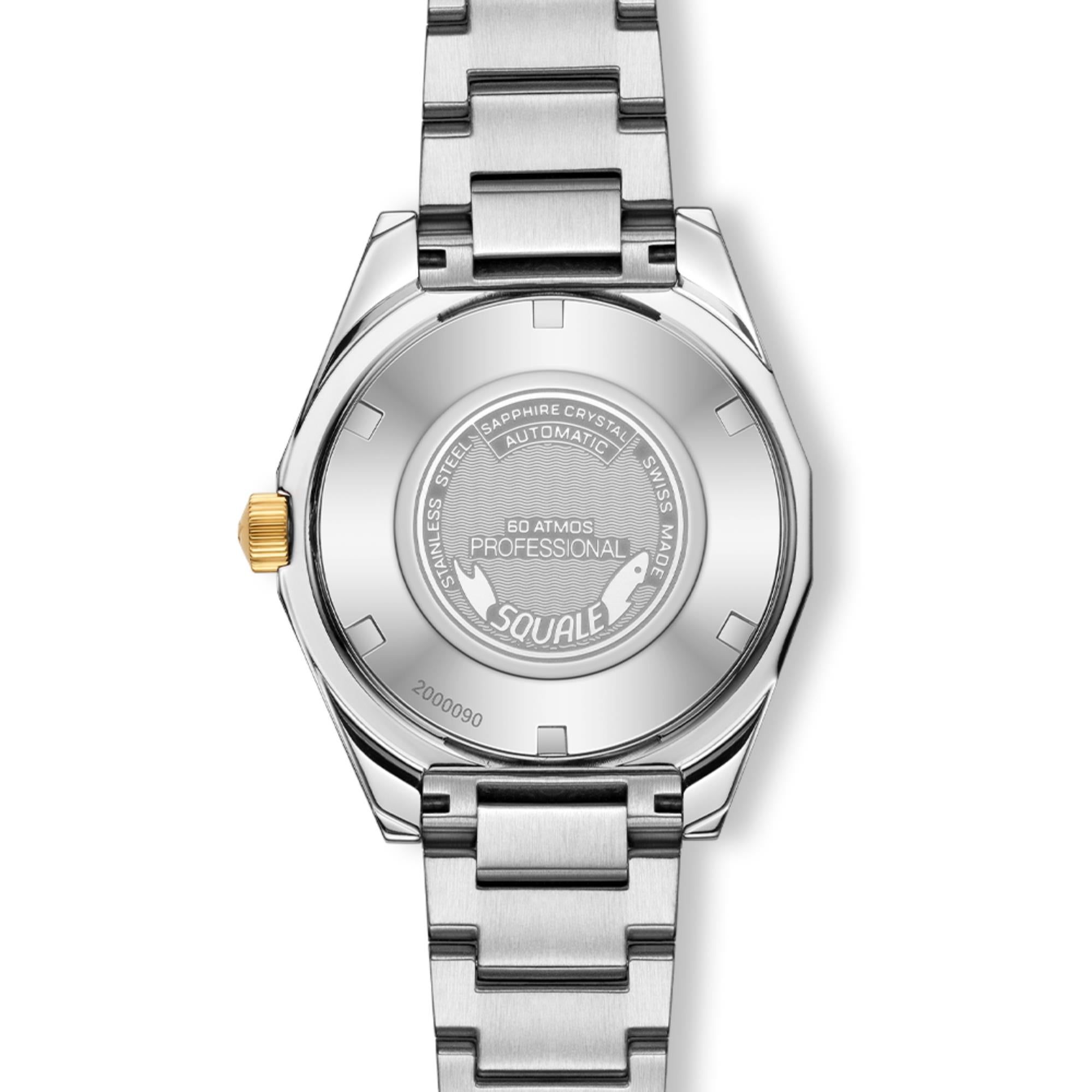 Steel automatic watch caseback with engraved text, screw-down back and gold-toned crown