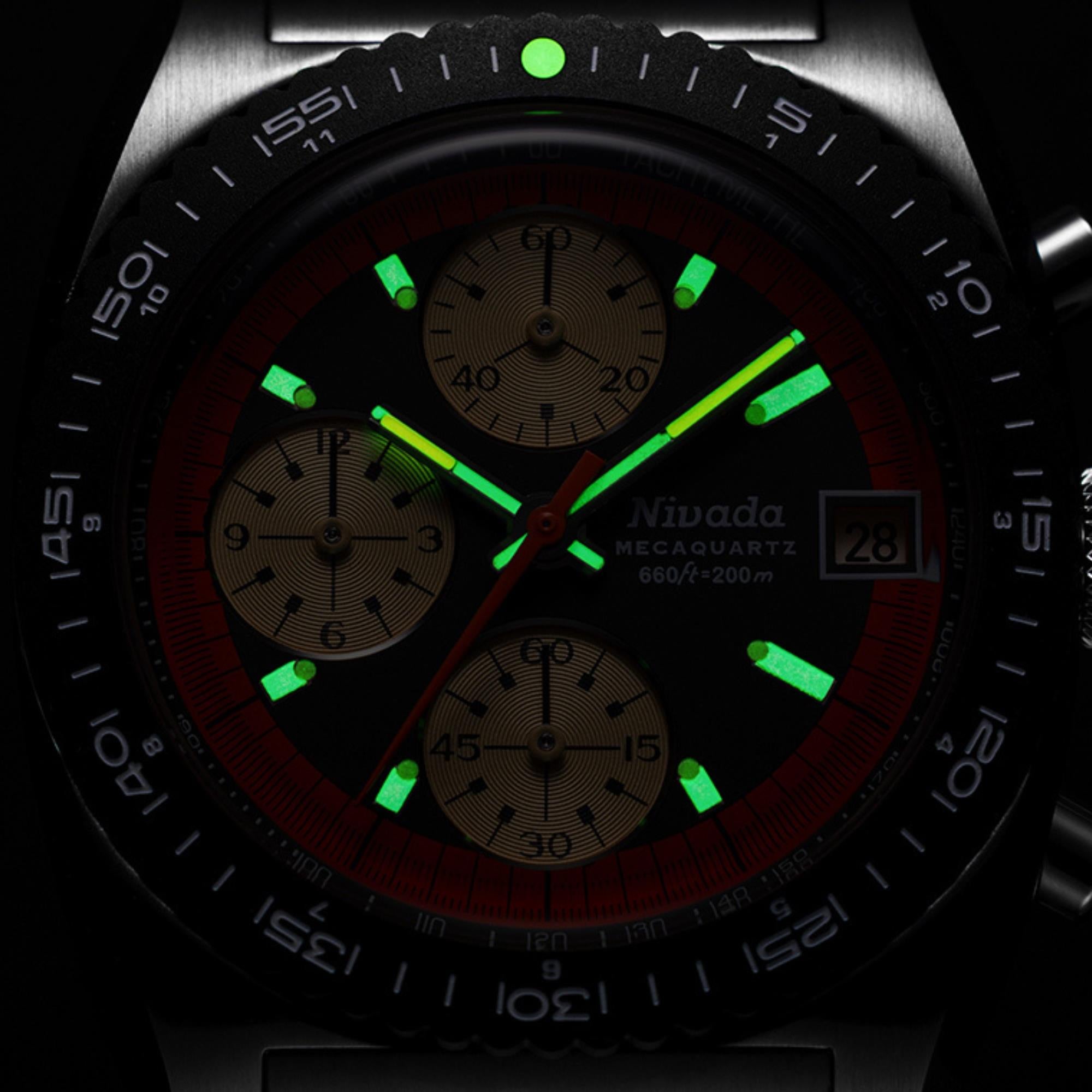 Men's chronograph wristwatch with green luminous dial markers and dark bezel