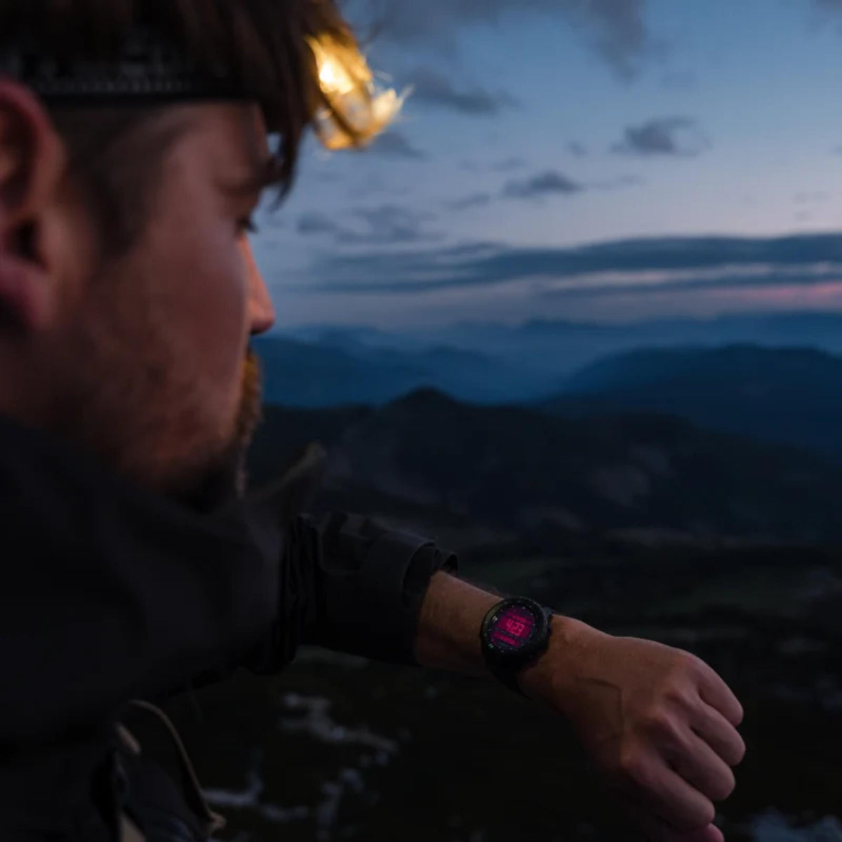 Suunto Core SS051780000 outdoor wrist shot showing digital watch face in low-light conditions