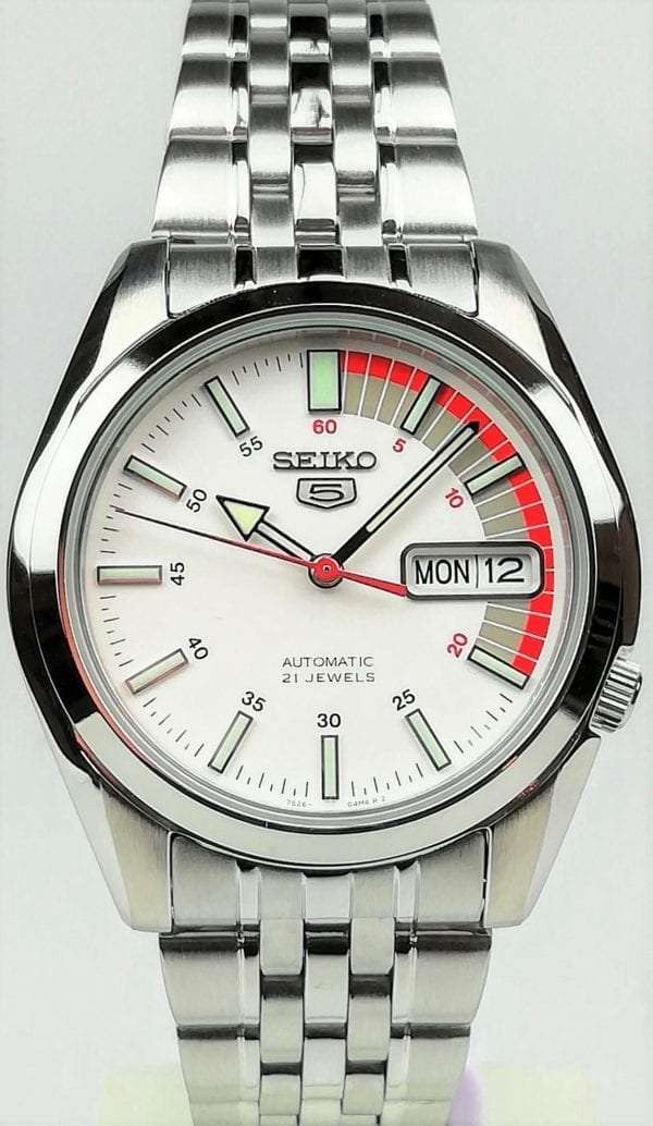 Seiko 5 Automatic White Dial Silver Stainless Steel Men’s WatchDriven by a 21-jewel automatic movement, this Seiko 5 Automatic White Dial Silver Stainless Steel Men’s Watch is a perfect addition to the wrist. At the 12 o’clock position is the ever present Seiko 5 logo with a day and date window at the 3 o’clock position. The hands of which are powered by an automatic movement are coated in a luminous material for easy visibility at night. Surrounding the dial is a silver stainless steel case to provide the dial with some protection. On the flip of the dial is an open case back window which allows you to see all the inner workings of the timepiece. Finally, a silver stainless steel bracelet can be fastened using a deployment clasp.This watch has a water resistance of 30 metres, making it suitable for light splashes.Key Features:Exclusive Seiko 7S26 Calibre21-Jewel Automatic MovementDay-Date WindowWater Resistant to 30mOpen Case BackWhite DialSilver Stainless SteelDeployment ClaspAnalogue DisplayThe Family:The Seiko 5 family has set the standard in affordable, rugged and stylish watches since 1963. They incorporate simplicity, but seriousness. The name of the Seiko 5 derives from its five key attributes, which Seiko promised to include in every watch that belonged to the family. They are: automatic winding, displaying the day and date in a single window, water resistance, a recessed crown at the 4 o’clock position and a durable metal bracelet. 1963 marked the year that the Seiko 5 acted as a catalyst in the horological revolution in automatic watchmaking. Even after being in the market for over 50 years, albeit the Seiko 5 still remains as cool and relevant as ever. Though this serves as proof that expert craftsmanship and elegant design will never go out of fashion.The Brand: SeikoCeaseless determination to innovate in every aspect of the watchmaker’s art is what defines Seiko’s 135-year history. By embracing this ethos, Seiko has been responsible for a string of industry-leading advances in the technology of time. Notably, the creation of the world’s first quartz watch in 1969. Or equally impressive the creation of the world’s first TV watch in 1982. And even more relevant today, with our abhorrent use of non-renewable energy sources, Seiko’s Kinetic. This watch had the ability to generate its own power from the movement of the wearer, it was released in 1988. The listed technological developments serve as evidence to illustrate the revolutionary impact which Seiko has had on the watchmaking world. They are also remarkably unique in that they manufacture every aspect of every watch in-house. They even grow their own quartz crystals and sapphires, hence why Seiko are renowned for being watchmaking experts.Also, if you have any questions please click hereClick here to join our facebook and Instagram!